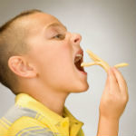 boy_eating_french_fries150